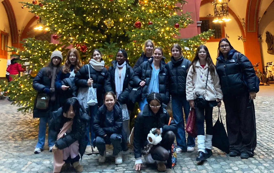 Students practise German at Basel’s Christmas market and learn the craft of paper making