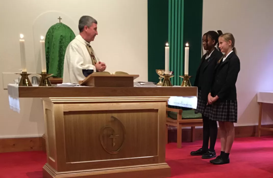 Students receive first Holy Communion